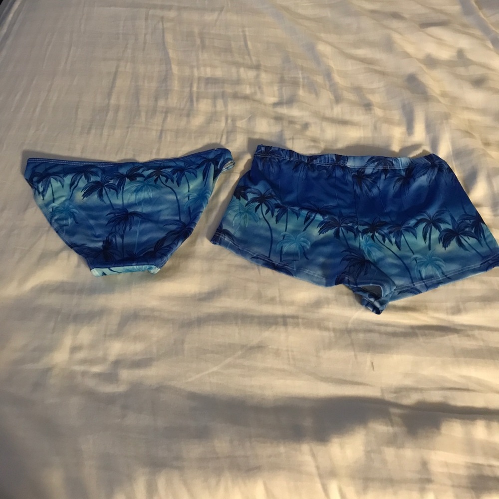 Two matching swimsuit bottoms with 🌴 pattern