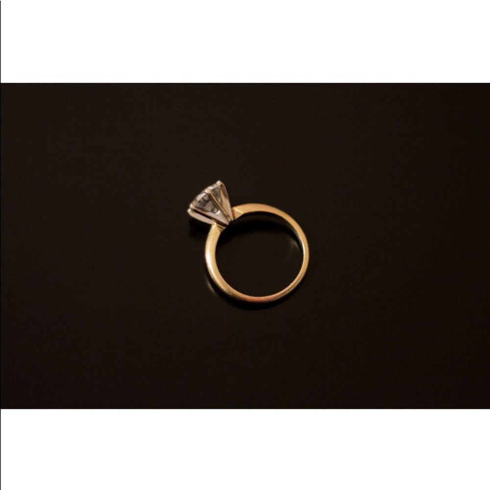 14k Gold Ring with 7mm CZ diamond.