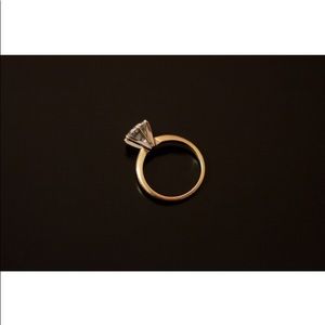 14k Gold Ring with 7mm CZ diamond.