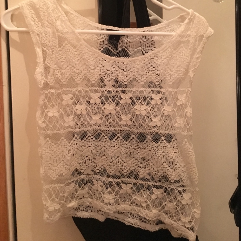White, see through, short sleeved shirt.