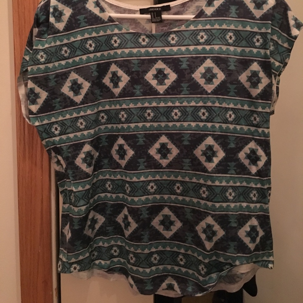 Short sleeved Aztec design shirt.