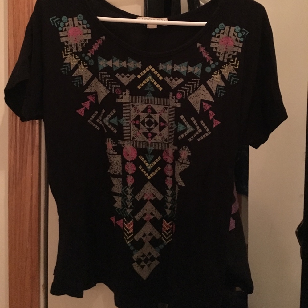 Short sleeved aztec design shirt.