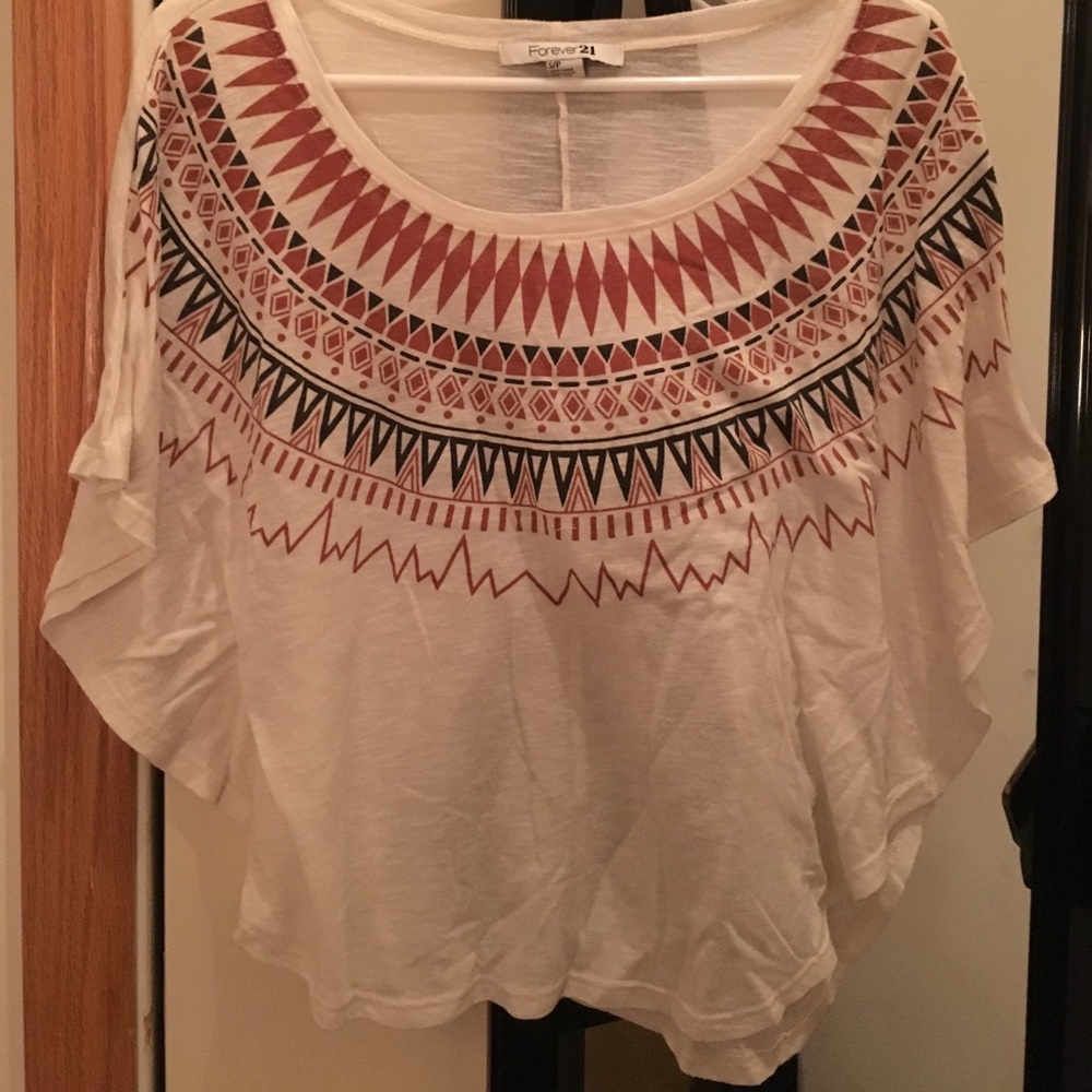 Short sleeved shirt with various designs on front.