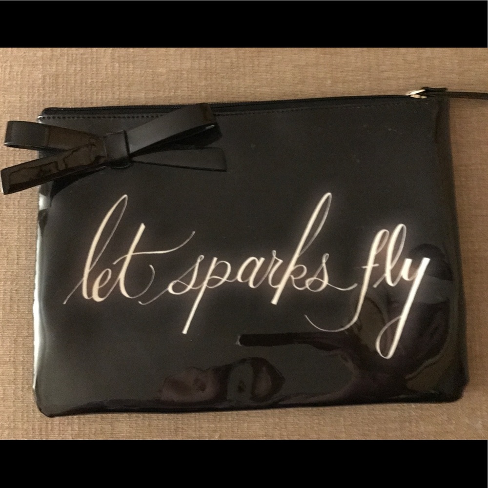 Kate Spade over sized wristlet let sparks fly
