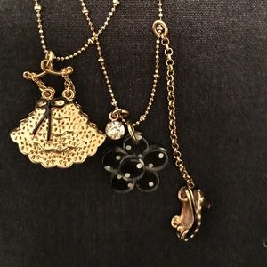 Betsey Johnson necklace with 3 pendants.