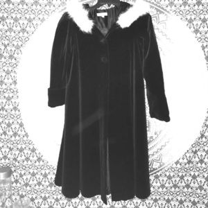 Black Knee length fox fur lined coat.