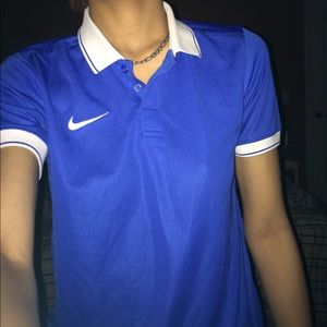 A sports button up beautiful blue Nike top