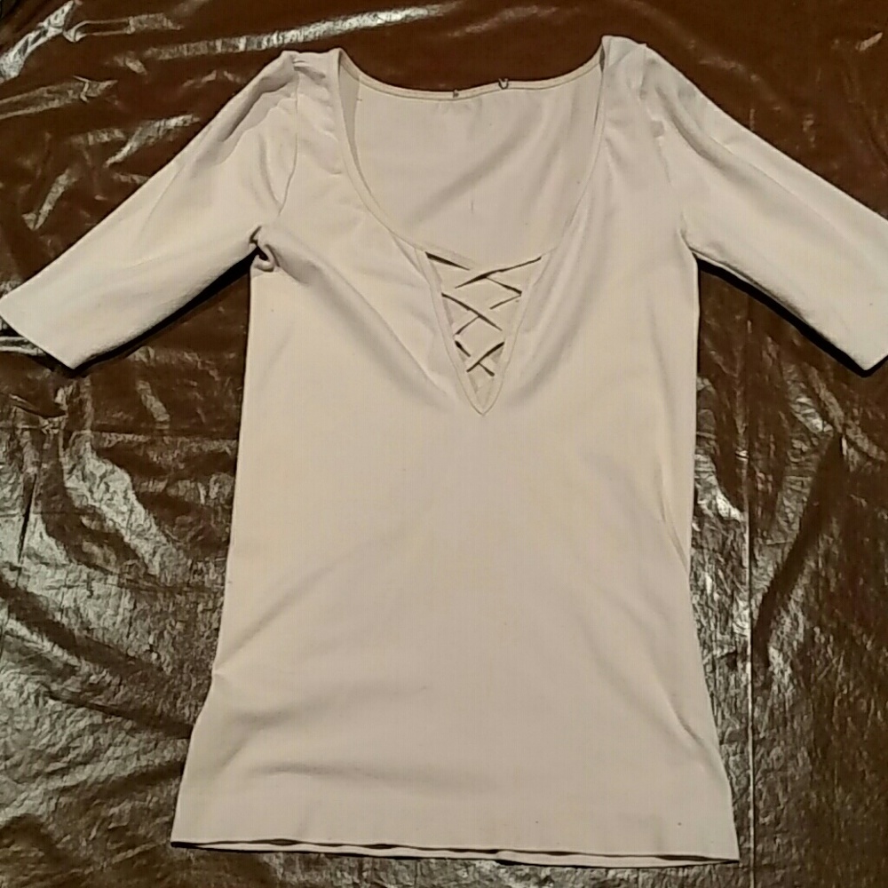 Nude, lycra, spandex fabric top.