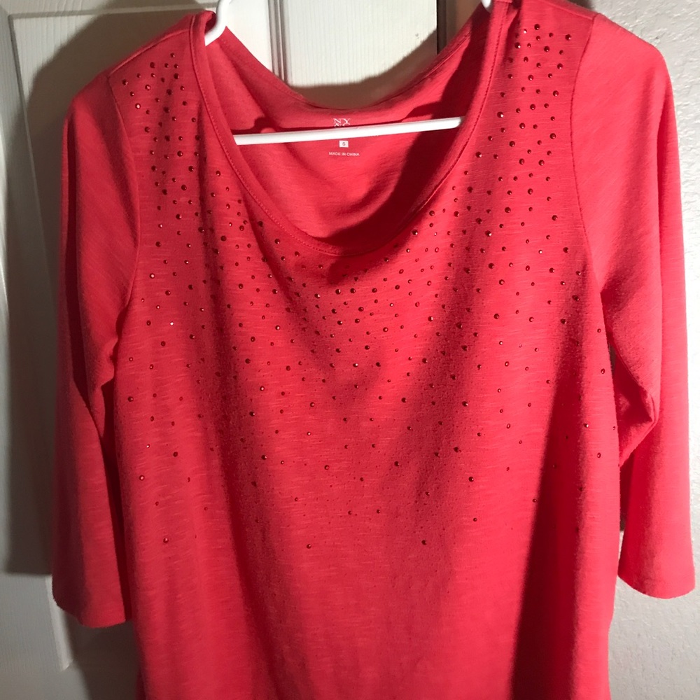 Pink shirt, fits a little big.