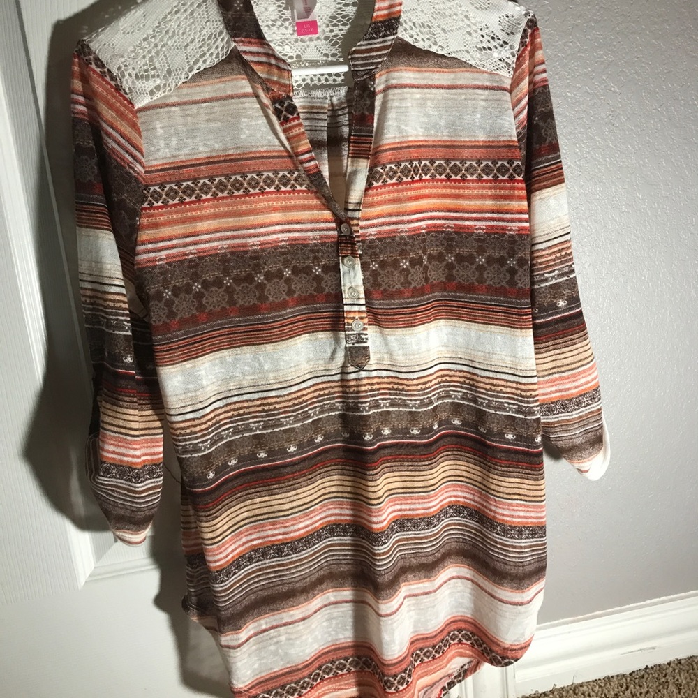 Long in the back, long sleeve shirt.