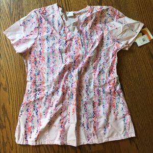 Pink scrub top NWT. Beautiful colorful flowers.