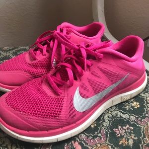 Pink Nike Free 4.0 running shoes