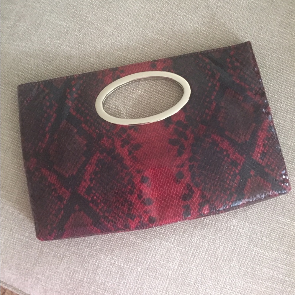 Faux red and black snakeskin clutch