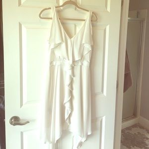 Crisp white sleeveless ruffle dress