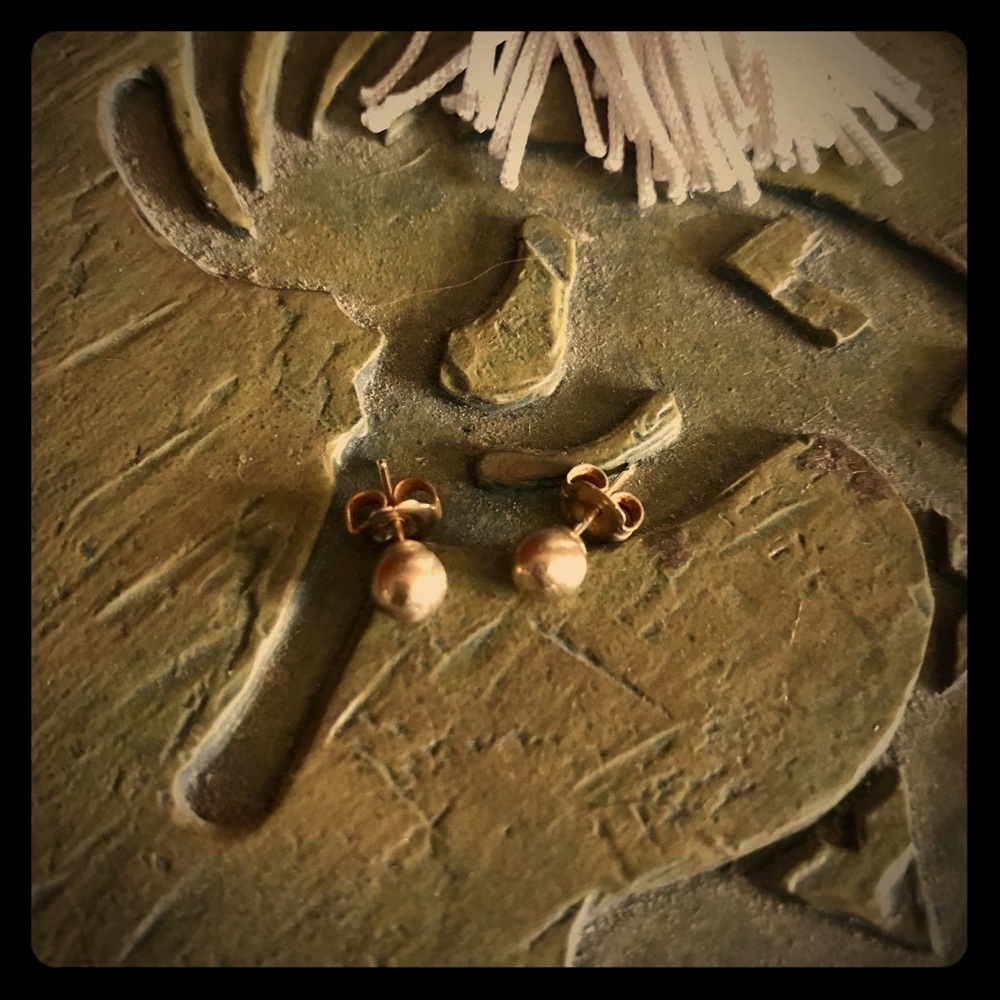 Gold post earrings.