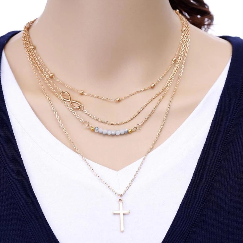 5/$25 Gold multi layer necklace infinity cross