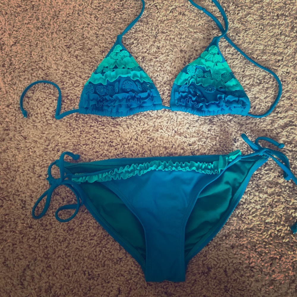 blue/teal ruffled bikini with embedded beading