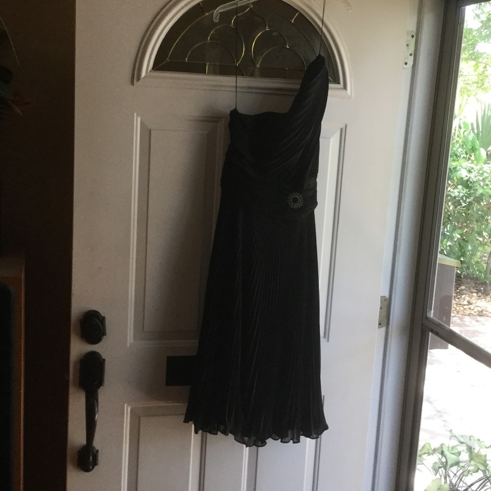 Black one shoulder pleated dress.