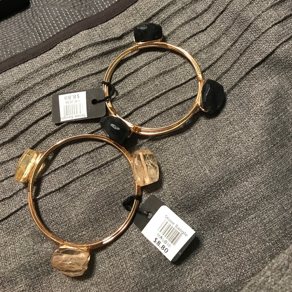 Two gold and black bracelets!