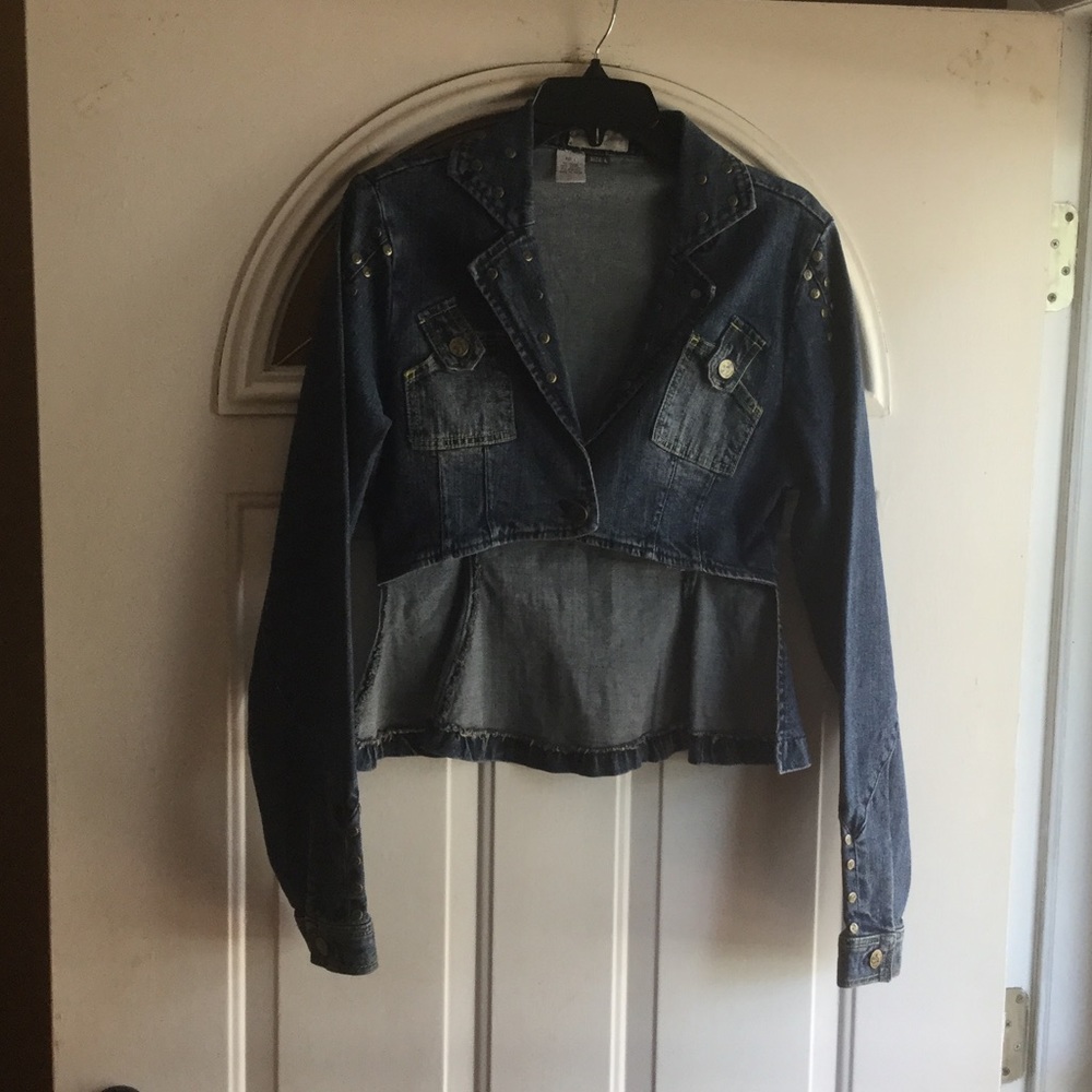 Jean jacket with gold studs on front.