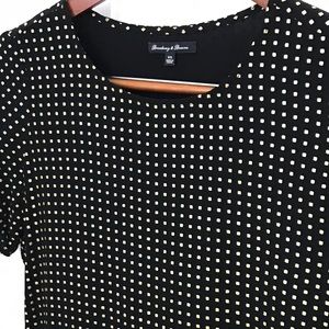 Contemporary black blouse with gold polka squares