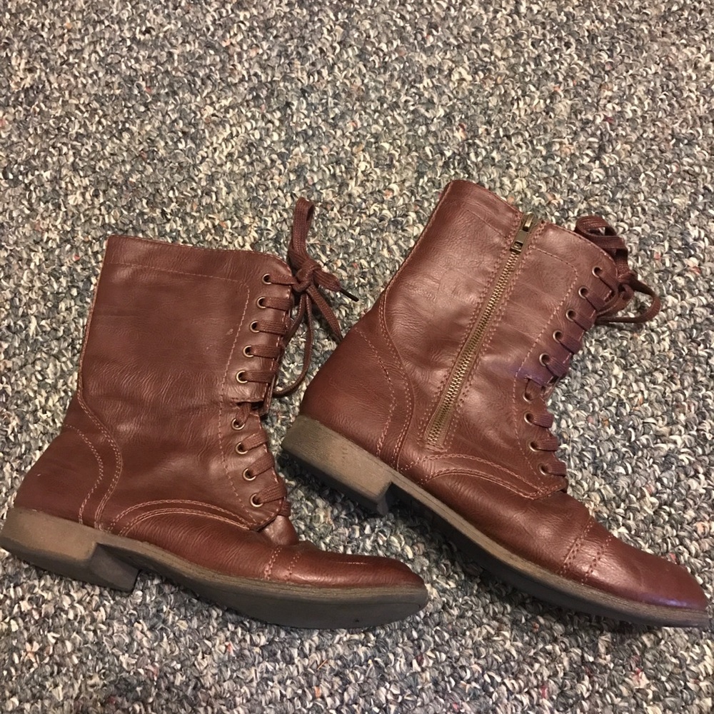 High top brown laced up boots/shoes.