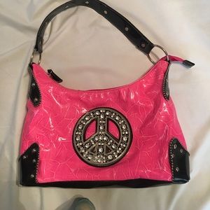 Neon pink peace sign purse