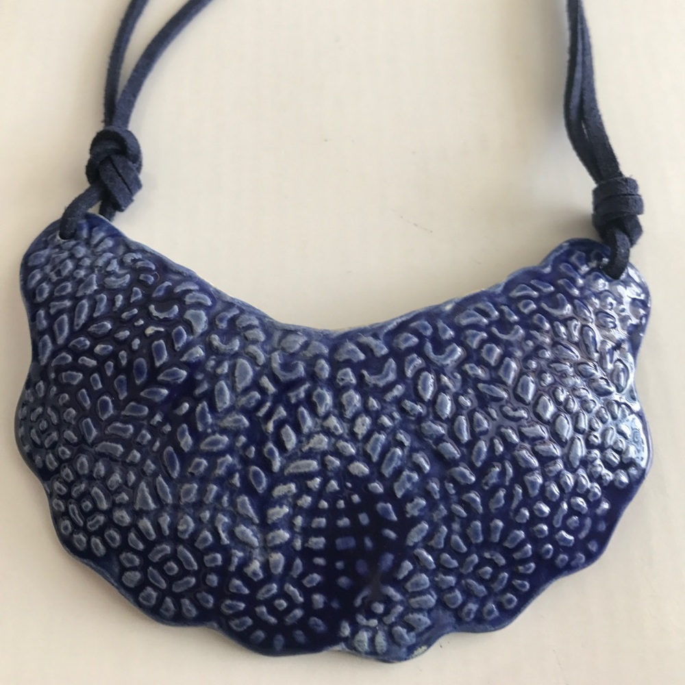 Handmade ceramic necklace.