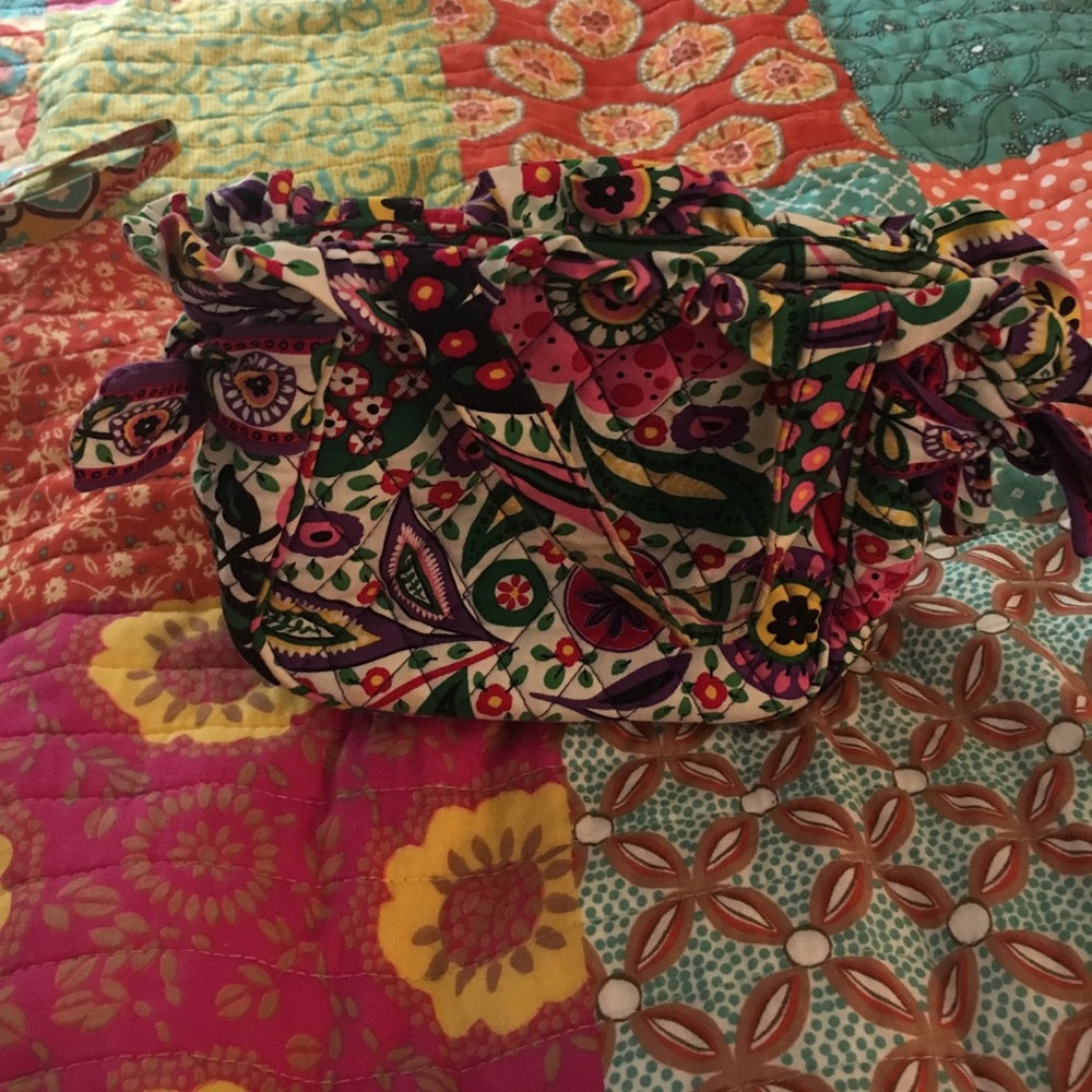 Small purse with beautiful floral detailing.