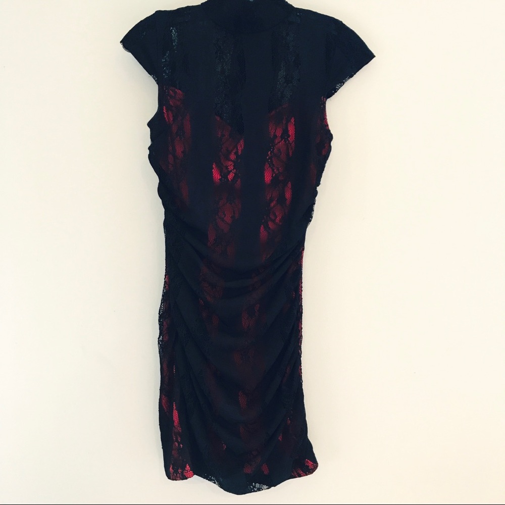 High neck black lace over a red dress