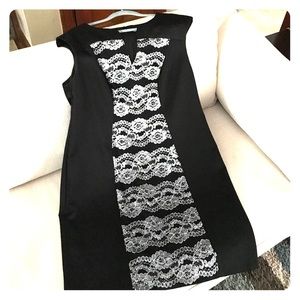 Cute sleeveless dress, black w/silver stitching.