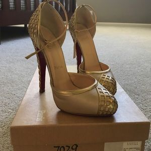 Christian Louboutin gold pumps