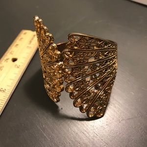 Gold tone cuff bangle bracelet