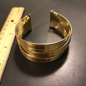 Gold tone cuff bangle bracelet