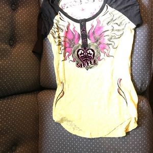 Nice black and yellow shirt with a pink design