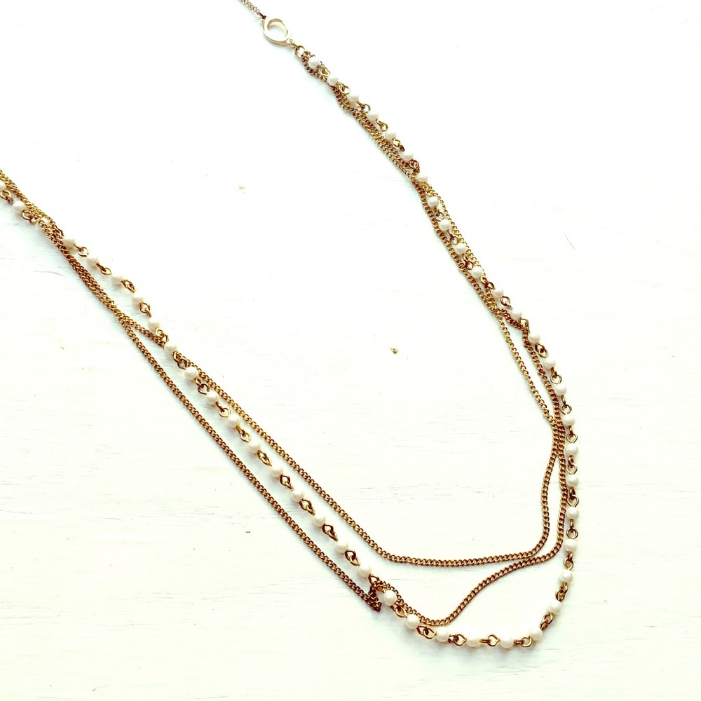 Long gold and pearl necklace