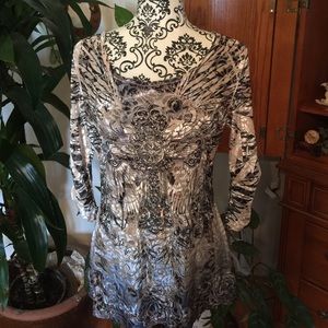 Soft sequin three quarter sleeve velour top.