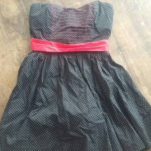 Retro black polka dot dress with red sash