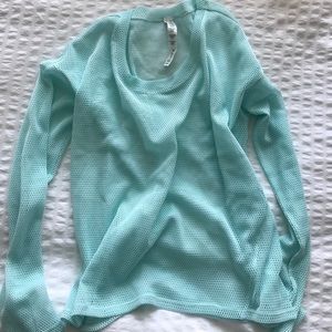 ALO YOGA. light teal/blue mesh log sleeve top