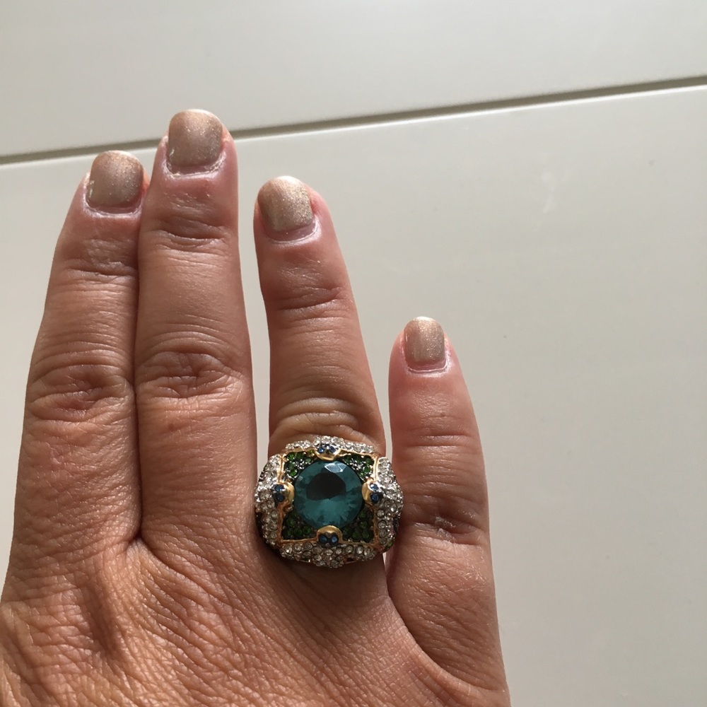 Gorgeous gold-plated ring with colorful gemstones.