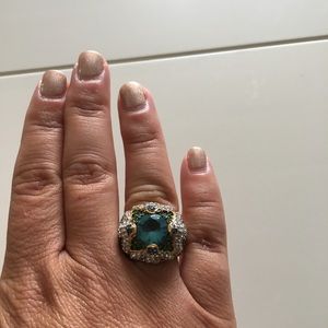 Gorgeous gold-plated ring with colorful gemstones.