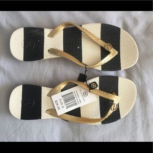 Brand new Vix black and gold flip flops