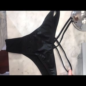 cheeky black bathing suite bottom with cross style