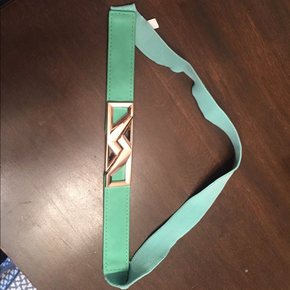 Lightly used mint green belt with gold buckle
