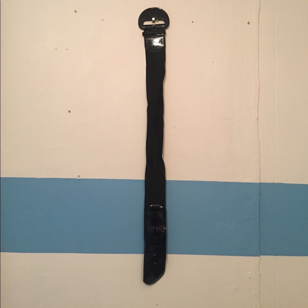 Lightly used faux leather and elastic black belt