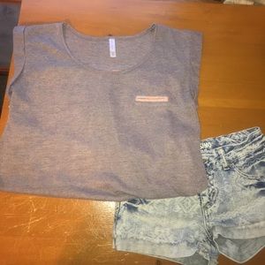 Flowy lavender shirt with 🦄🦋 pattern on the back