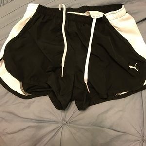 Black and white Puma running shorts