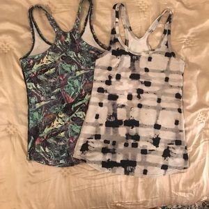 Pair of Lululemon racerback workout shirts