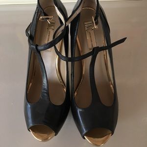 INC platform style black and gold.