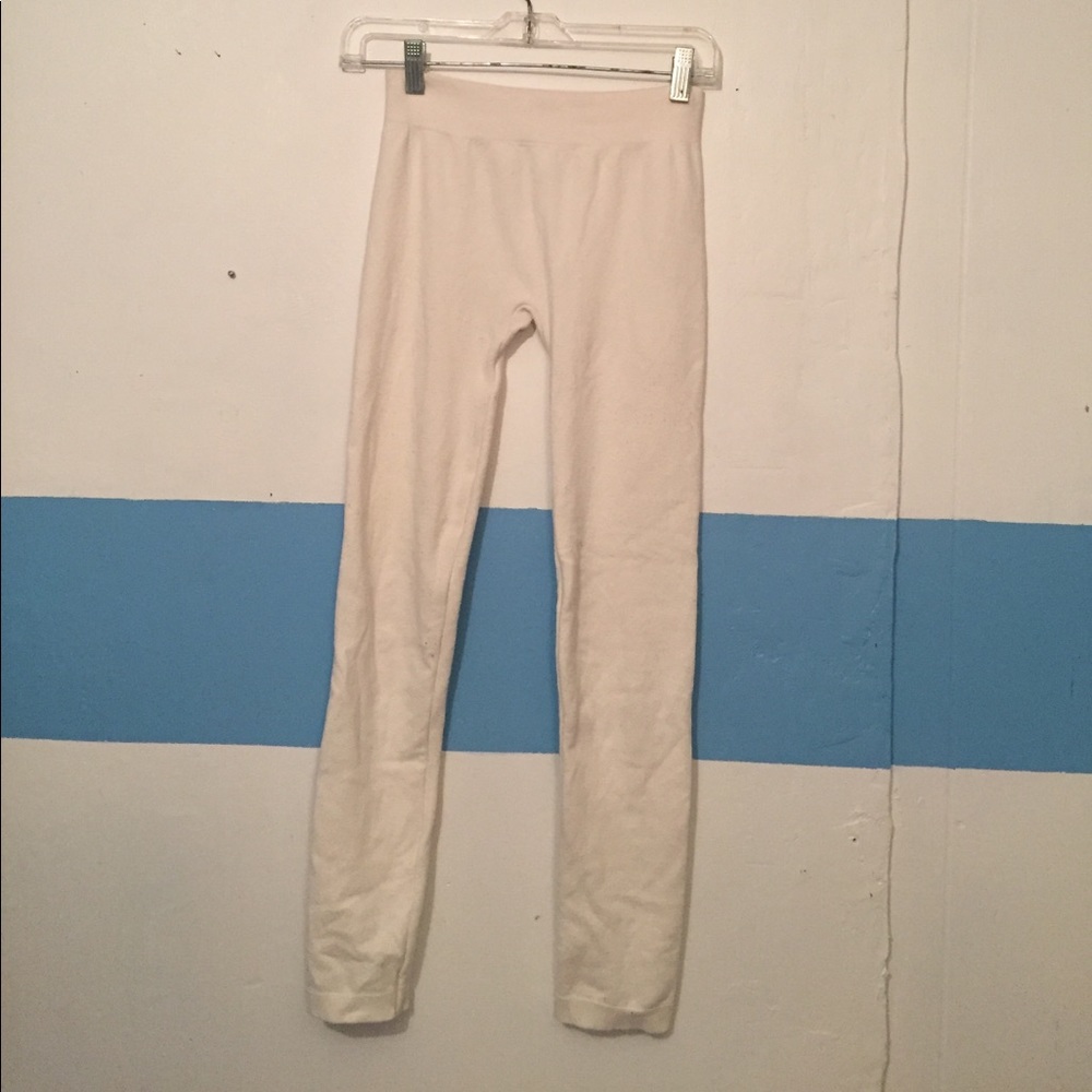 Lightly worn cream colored leggings